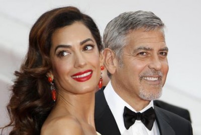     George Clooney  y   Amal    